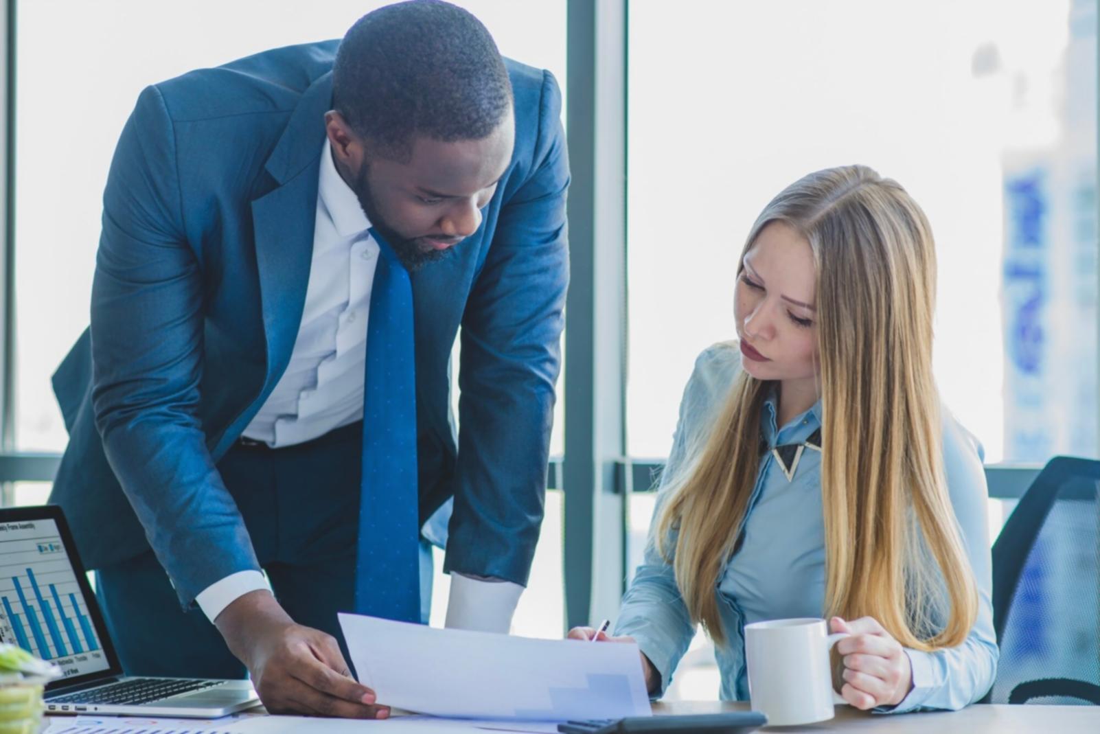 Business meeting discussing financial reports and strategic planning